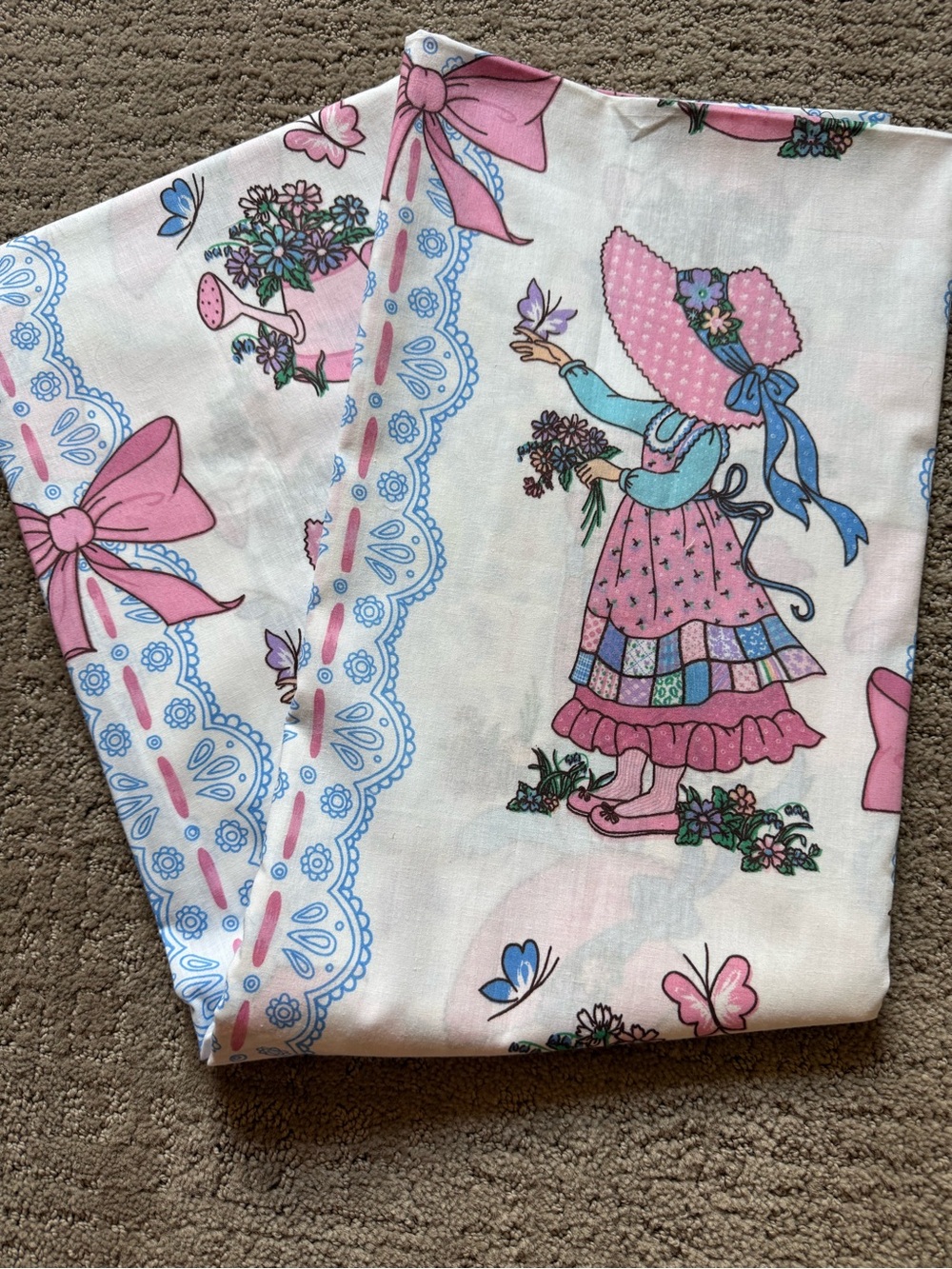 Vintage 1970s fabric featuring a nostalgic Holly Hobbie Sunbonnet Sue